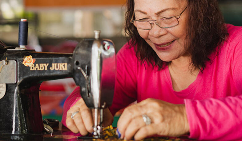 Philippino woman sewing